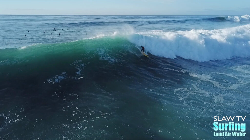 surfing big wave at reefs in san diego