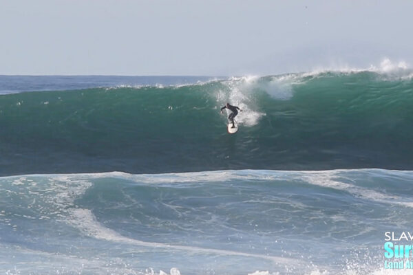 surfing big wave at reefs in san diego