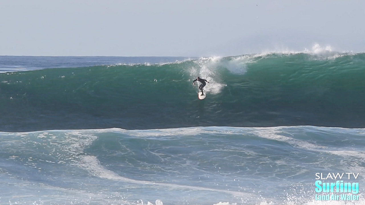 surfing big wave at reefs in san diego