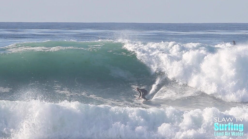 surfing big wave at reefs in san diego