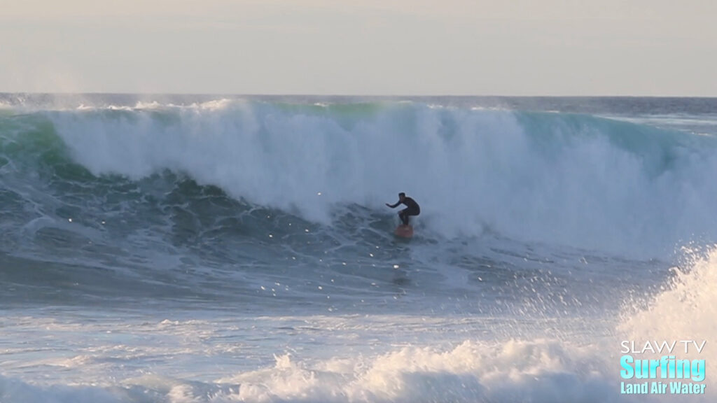 surfing big wave at reefs in san diego