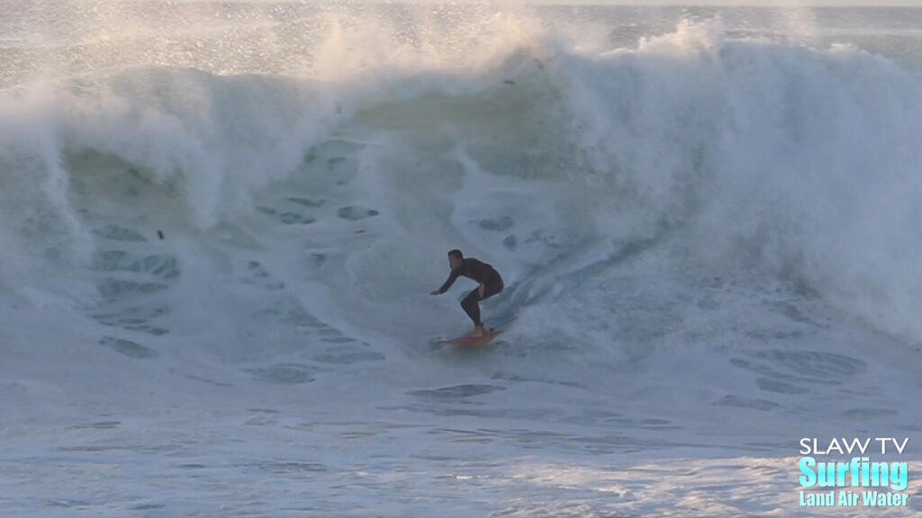 surfing big wave at reefs in san diego