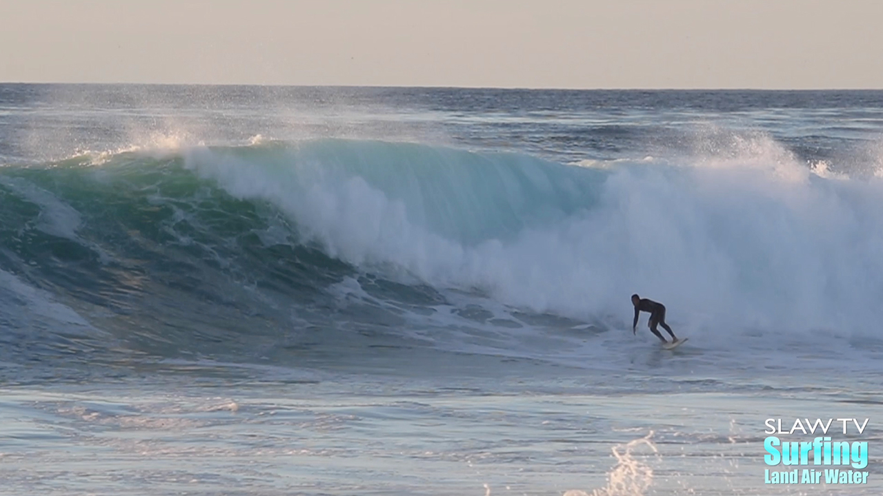 surfing big wave at reefs in san diego