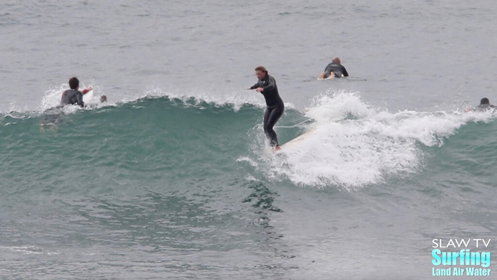 kaitlin maguire surfing longboards at swamis beach in encinitas