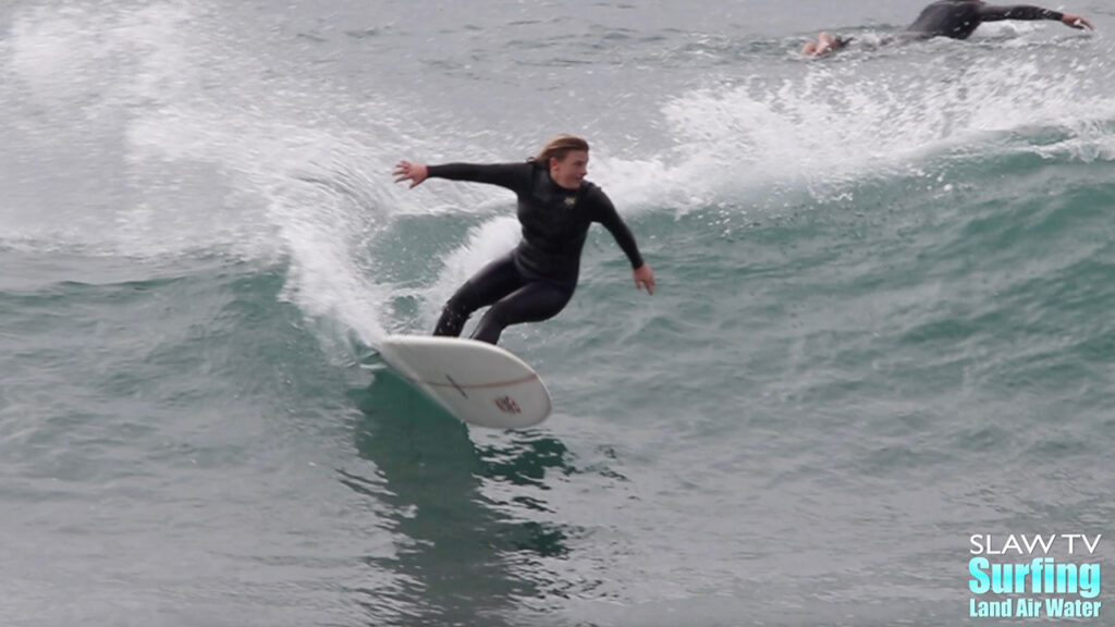 kaitlin maguire surfing longboards at swamis beach in encinitas