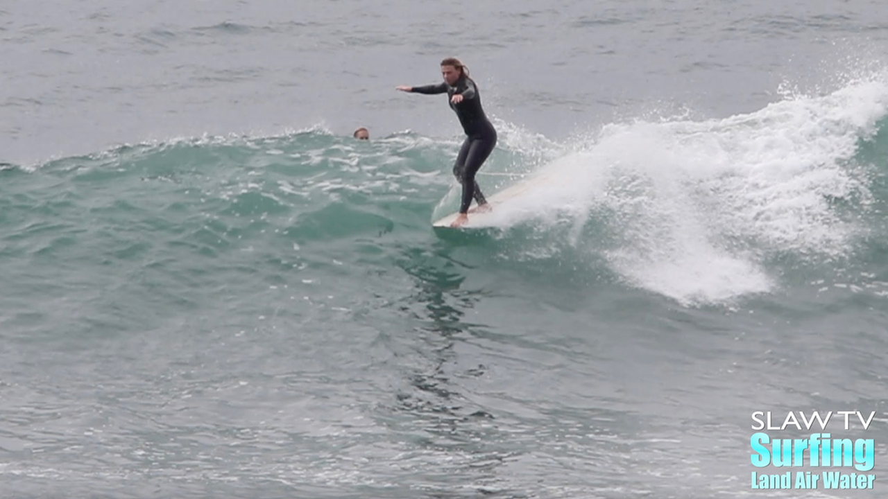 kaitlin maguire surfing longboards at swamis beach in encinitas