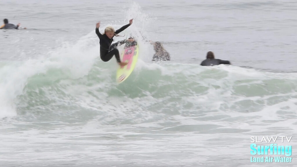 girl groms surfing waves at lowers trestles