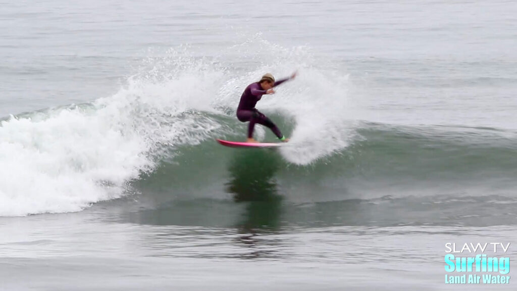 girl groms surfing waves at lowers trestles