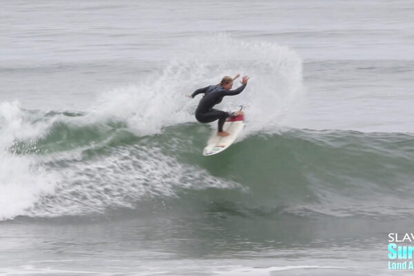 girl groms surfing waves at lowers trestles