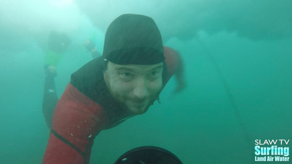 john cocozza diving under waves doing water photos