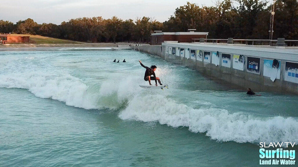 seager surfing team boosting airs at waco surf wave pool in texas