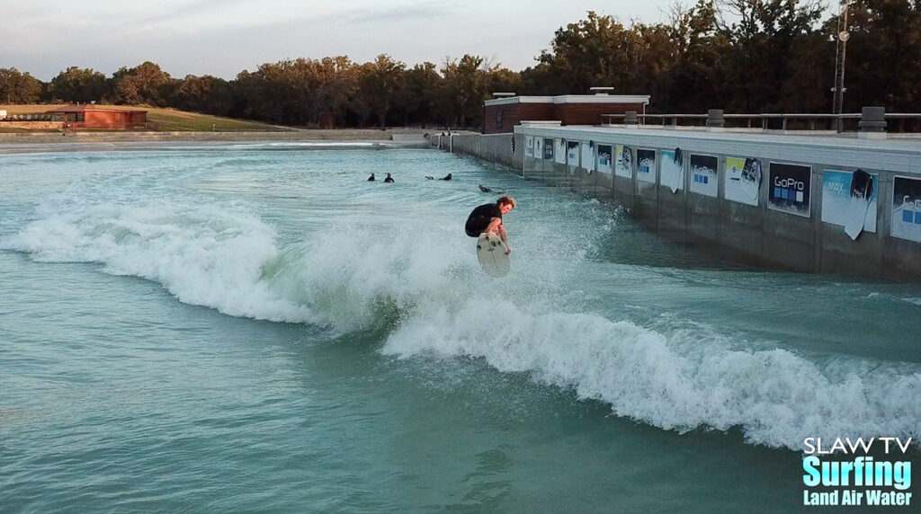 seager surfing team boosting airs at waco surf wave pool in texas