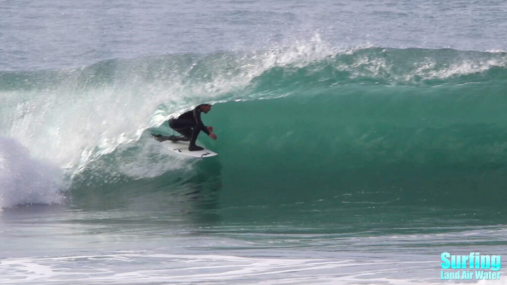 surfing barreling waves at the la jolla reefs in san diego