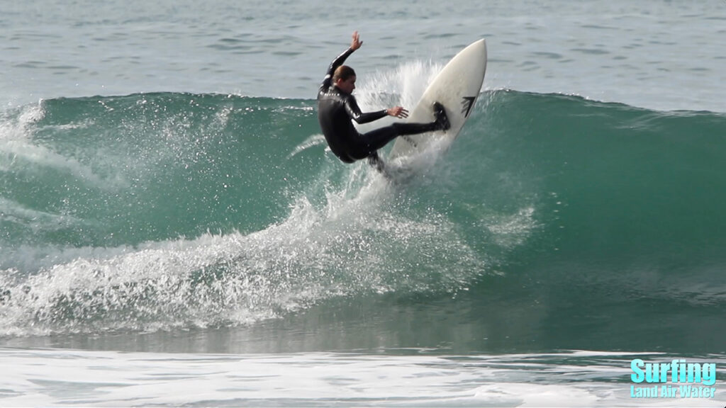 surfing waves at the la jolla reefs in san diego