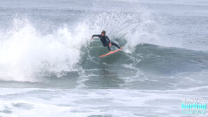 groms and young surfers riding waves in cardiff by the sea