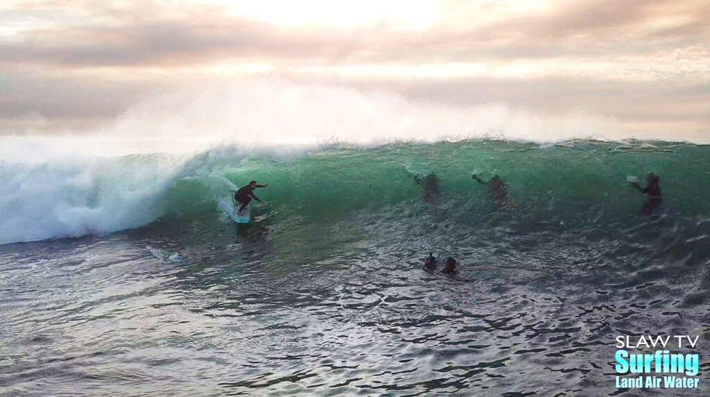 surfing aerial photo of barreling waves in san diego