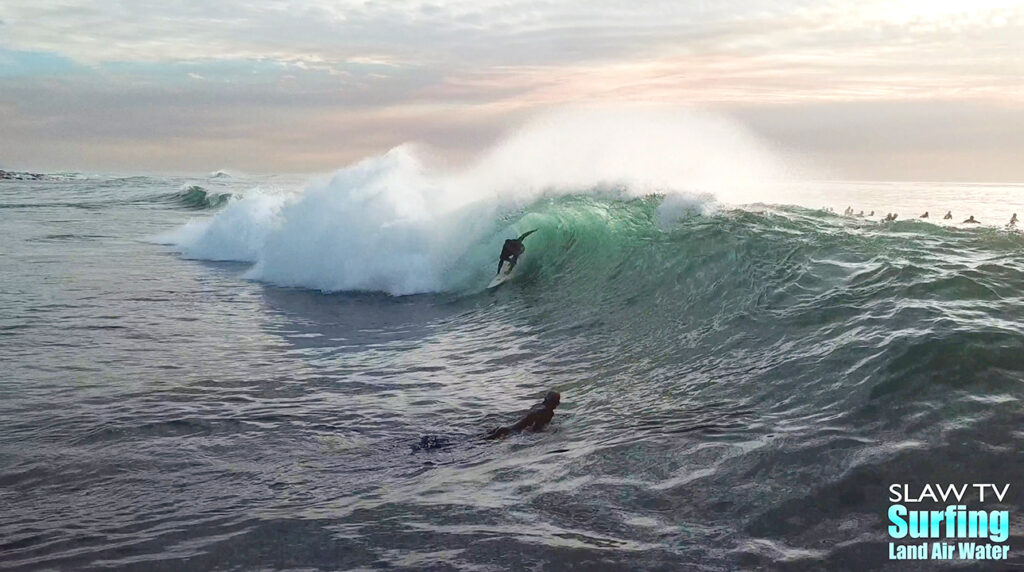 surfing aerial photo of barreling waves in san diego