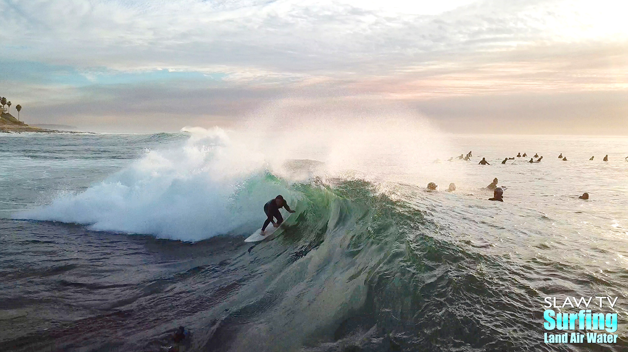 surfing aerial photo of barreling waves in san diego