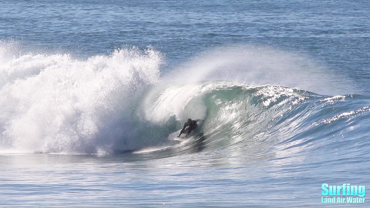 surfing perfect barreling waves at la jolla reef in san diego