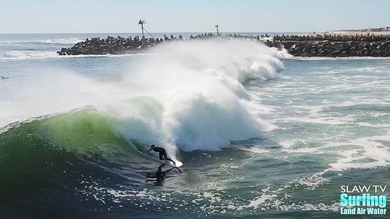 surfing big hurricane waves at manasquan inlet new jersey