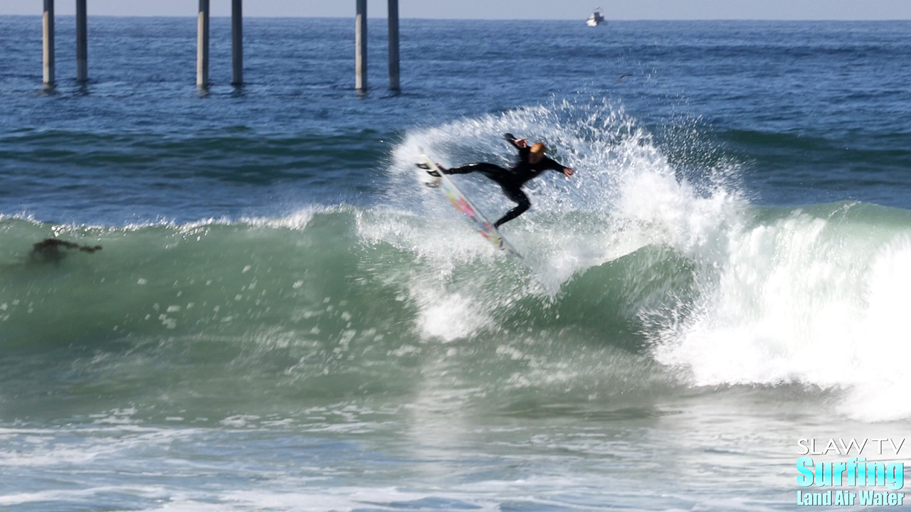 surfing waves on windy morning in ocean beach san diego