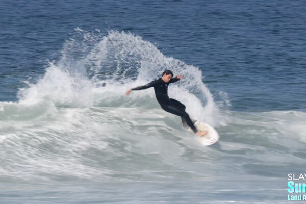 surfers in pacific beach riding great waves