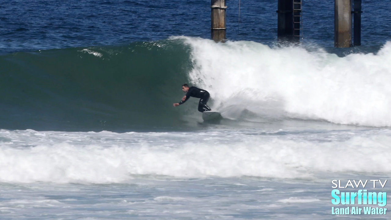 surfing waves at scripps pier in la jolla san diego