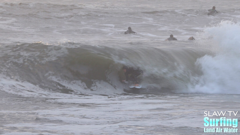 surfing a novelty sandbar on the california coastline with barreling waves