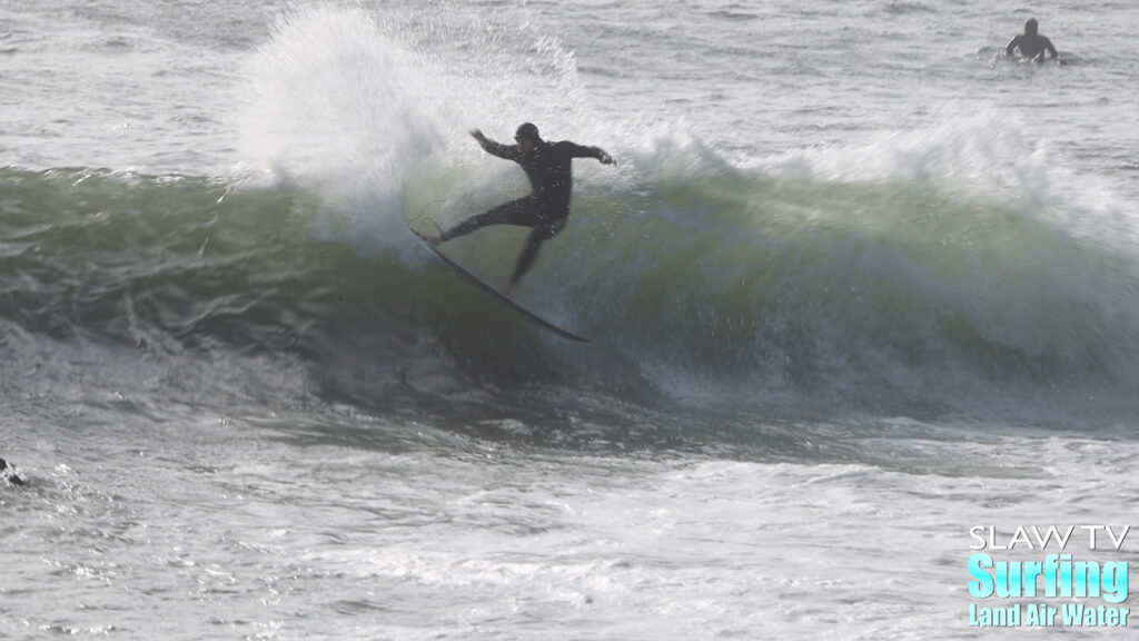 surfing a novelty sandbar on the california coastline with barreling waves