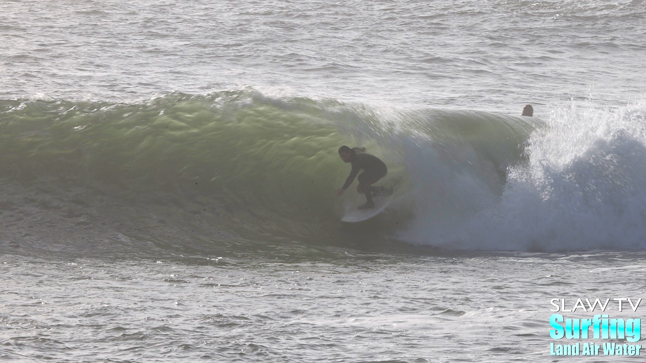 surfing a novelty sandbar on the california coastline with barreling waves