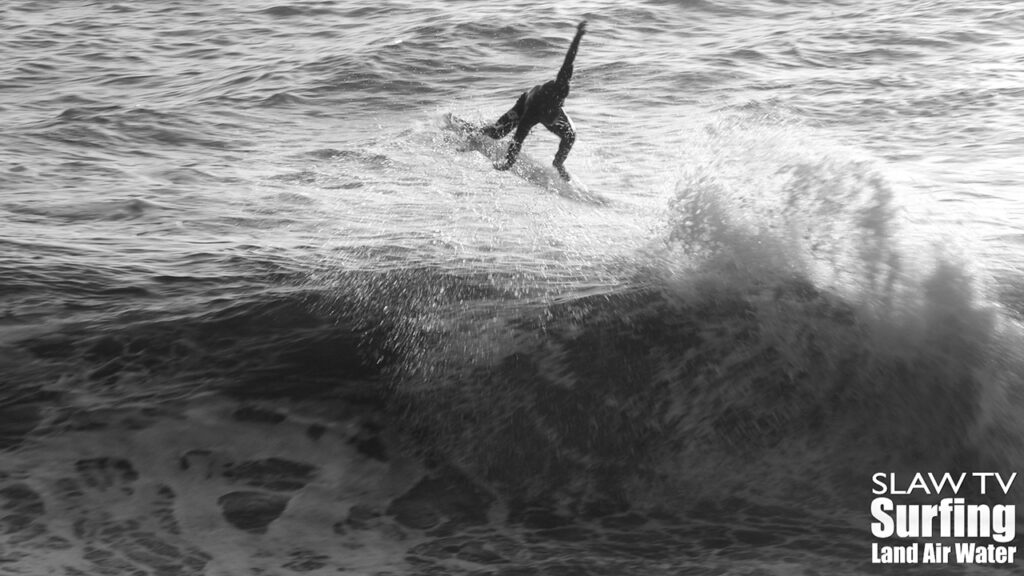 surfing a california sandbar wave that has hollow barrels