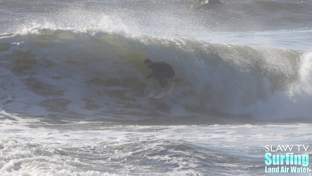 surfing california novelty barreling sandbar during winter storm